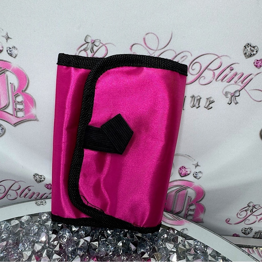 Jewelry holder travelling bag opens up and can hang pink tie dye inside plastic